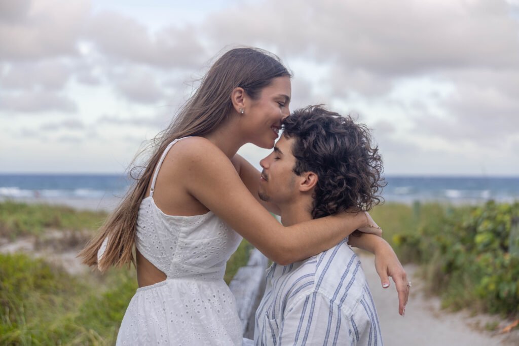 Romantic couple embracing ocean view West Palm Beach engagement photographer LGBTQ inclusive love