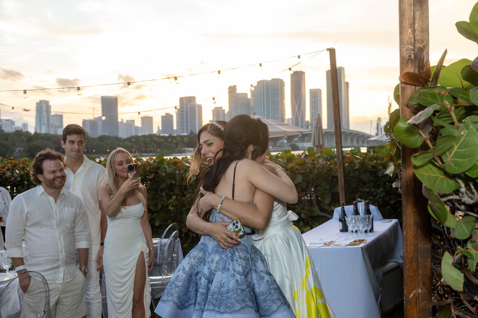 Couple embracing at an outdoor evening celebration in Miami