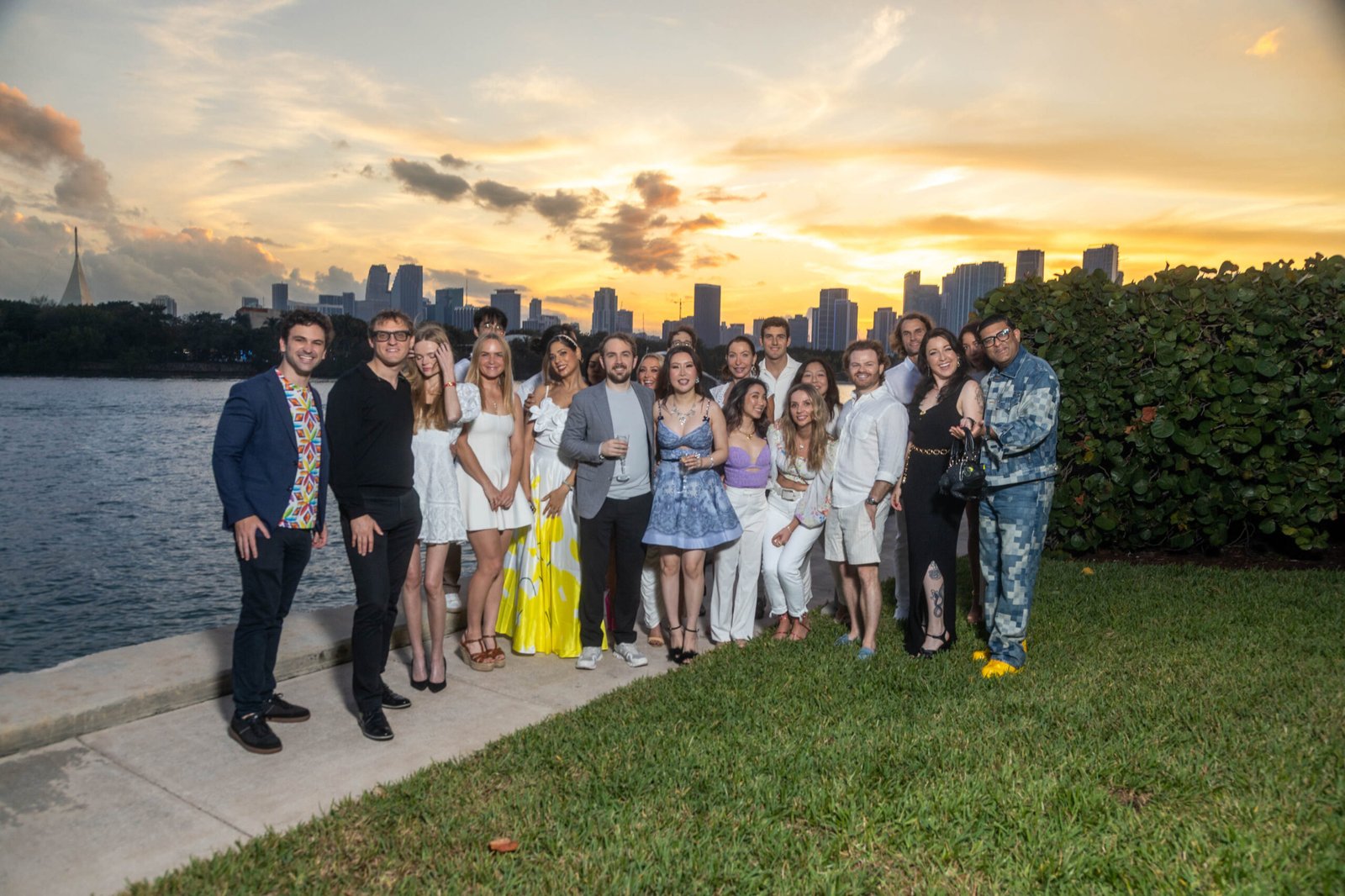 Group of guests at an outdoor dinner at golden hour in Miami