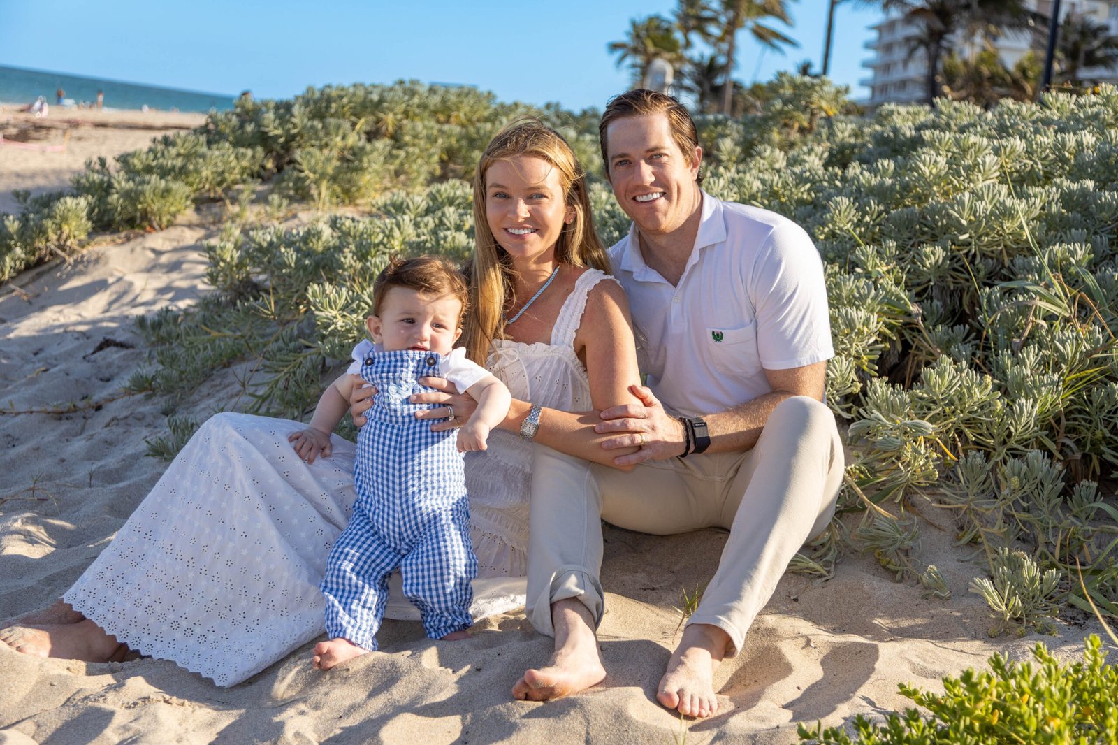 Coordinated family of three in light tones in the beach dunes in West Palm Beach