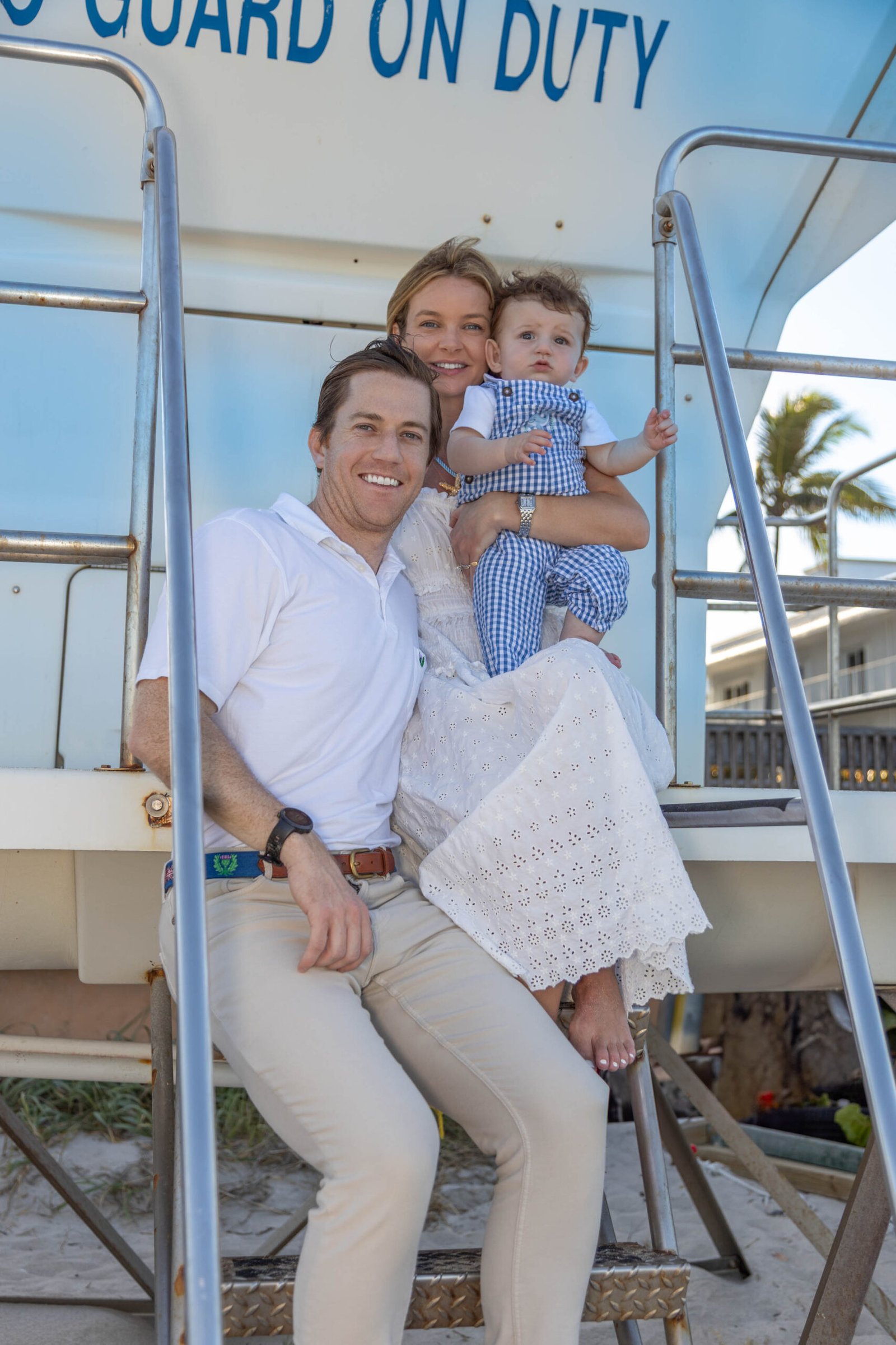 Family with their baby beside a lifeguard stand in West Palm Beach