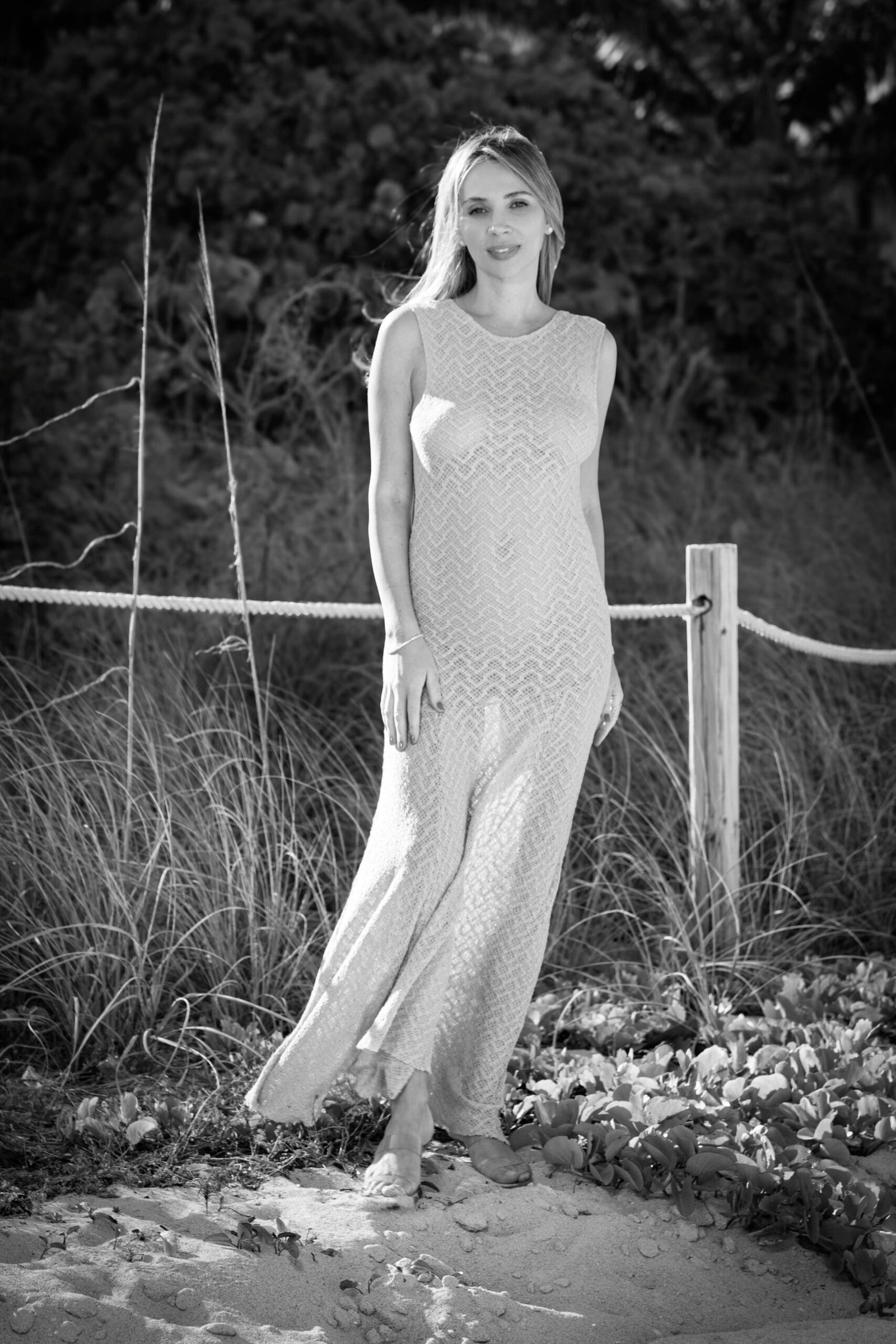 Black and white maternity portrait of a mother-to-be on the beach in West Palm Beach