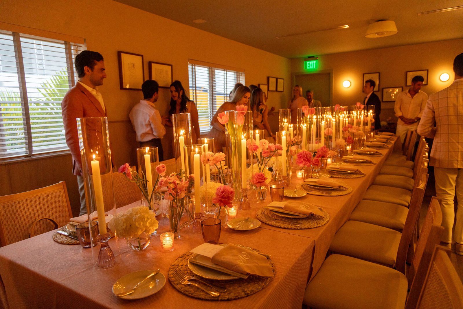 Long banquet table set with candles for an elegant evening dinner in Palm Beach