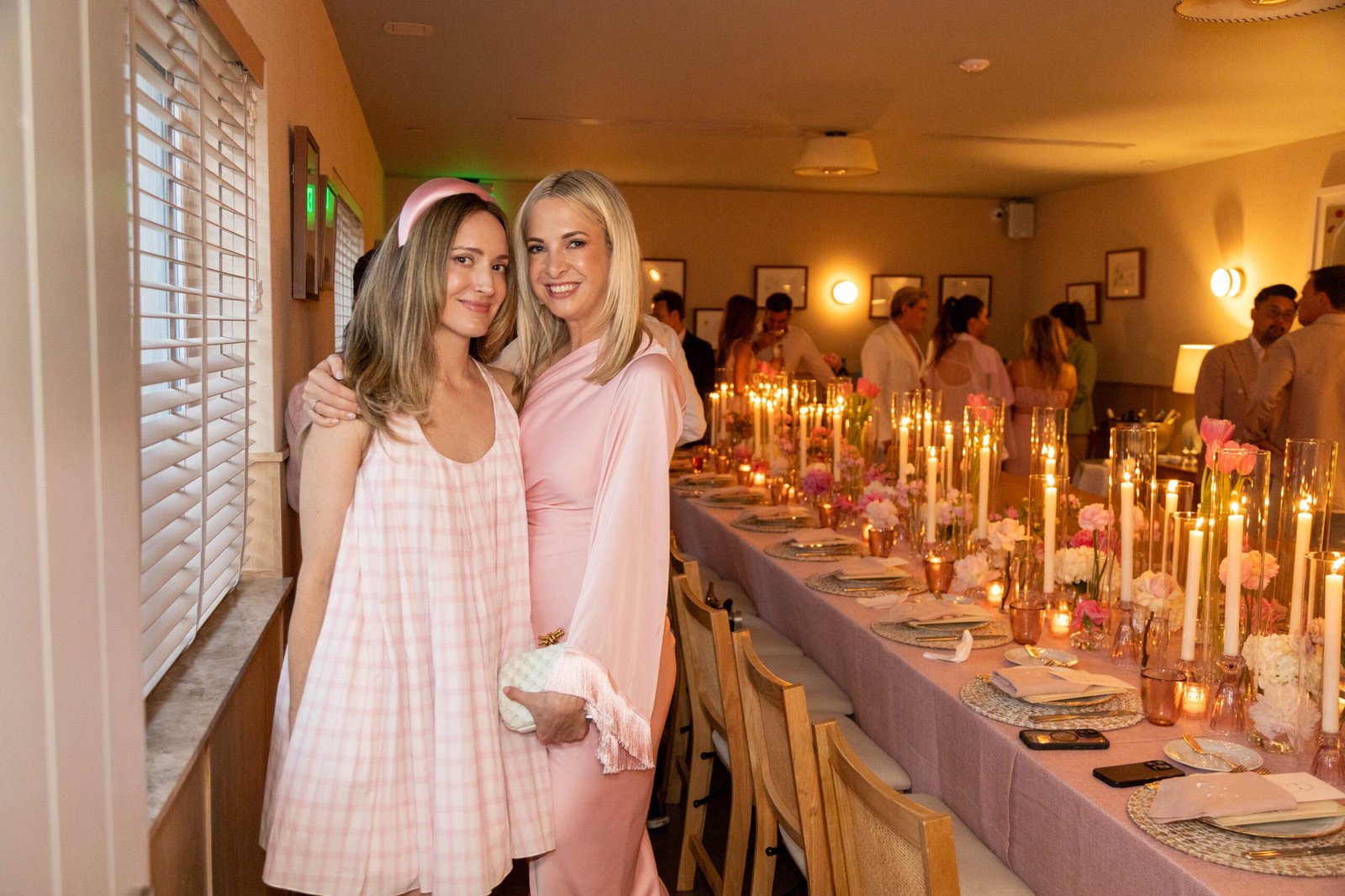 Women in floral outfits at a daytime social event in Palm Beach