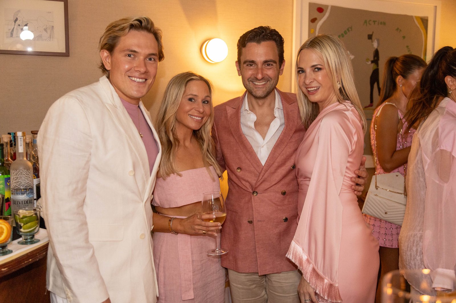 Guests raising a toast at a networking reception in Palm Beach