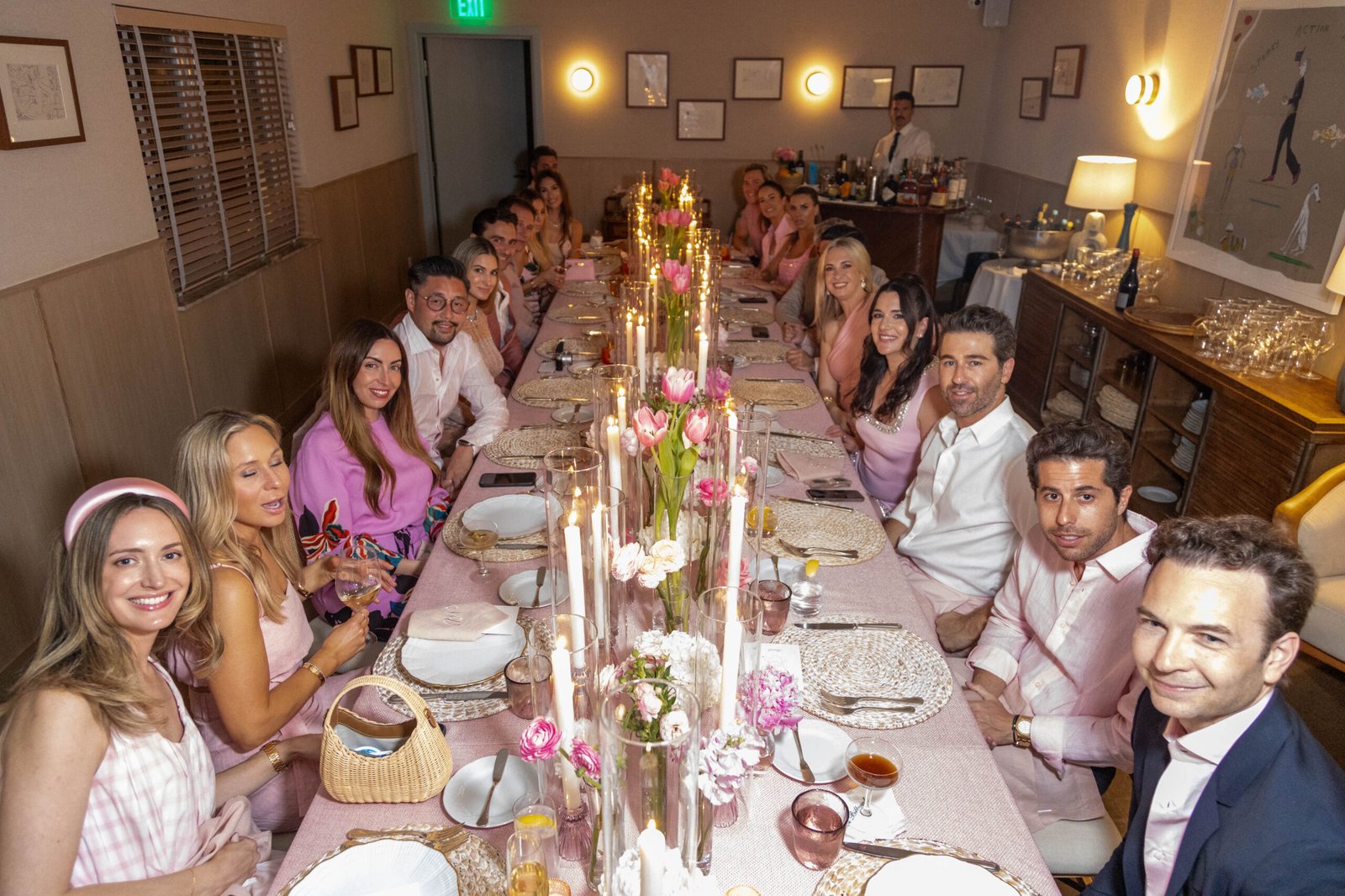 Long banquet table filled with guests at a corporate dinner in Palm Beach