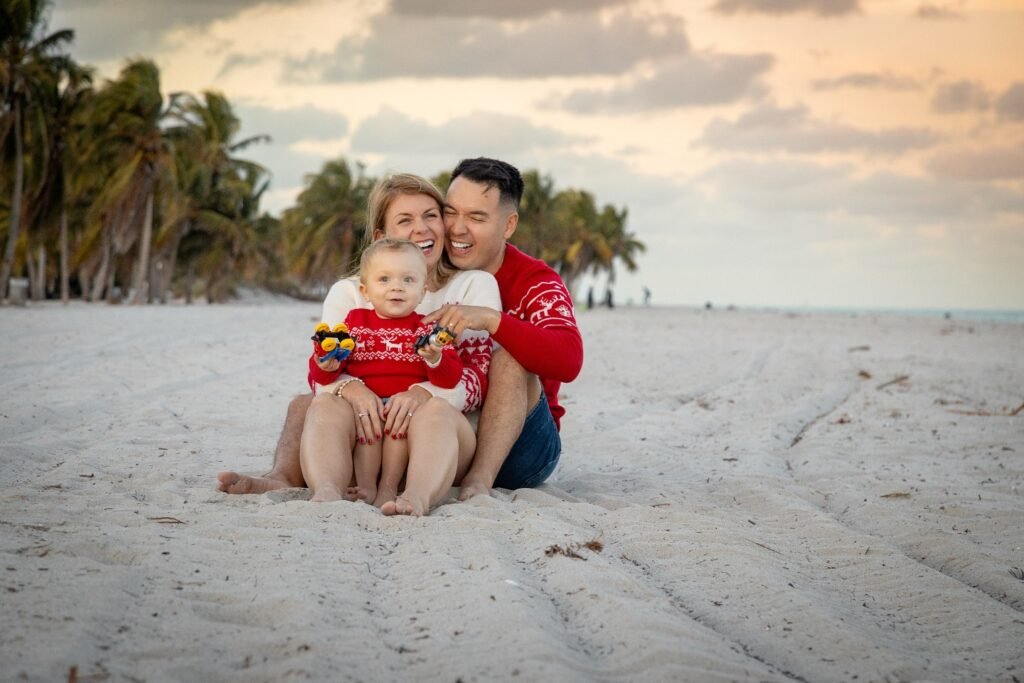Family on the beach in matching outfits West Palm Beach family photographer