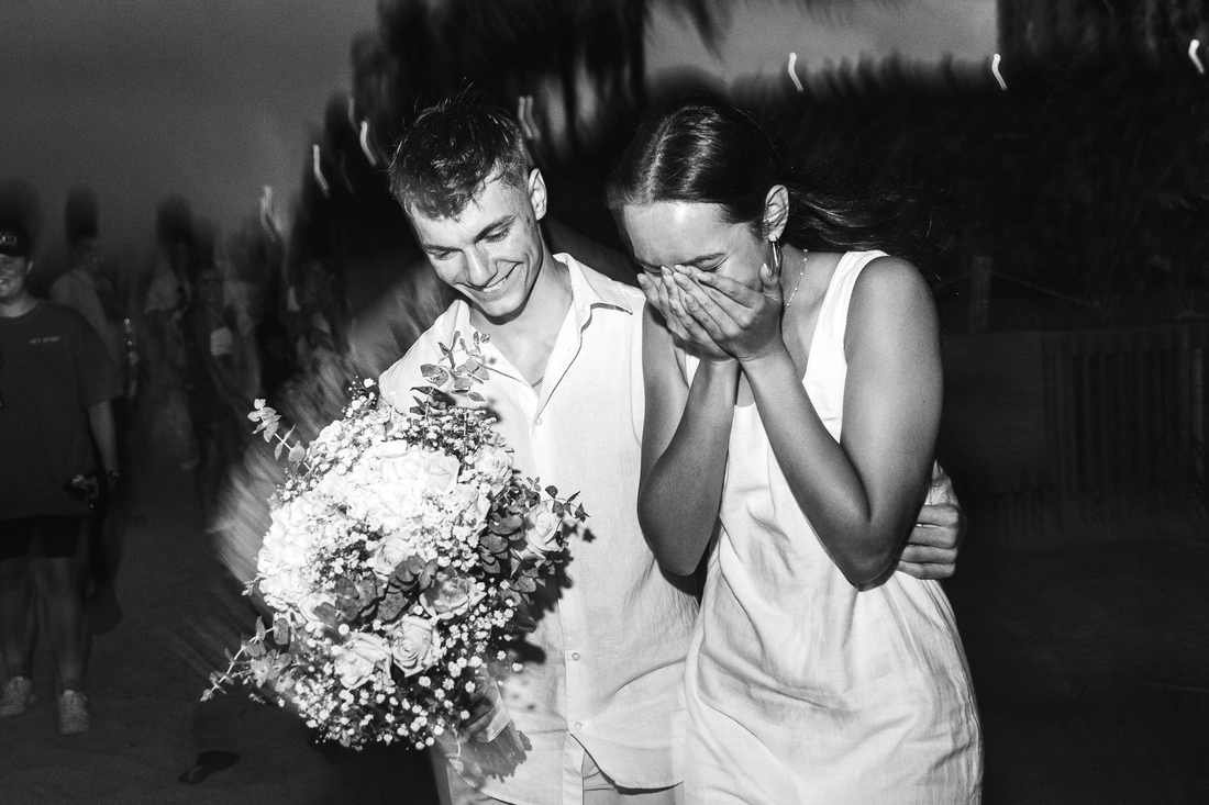 Emotional black and white moment as she says yes during a surprise beach proposal in West Palm Beach