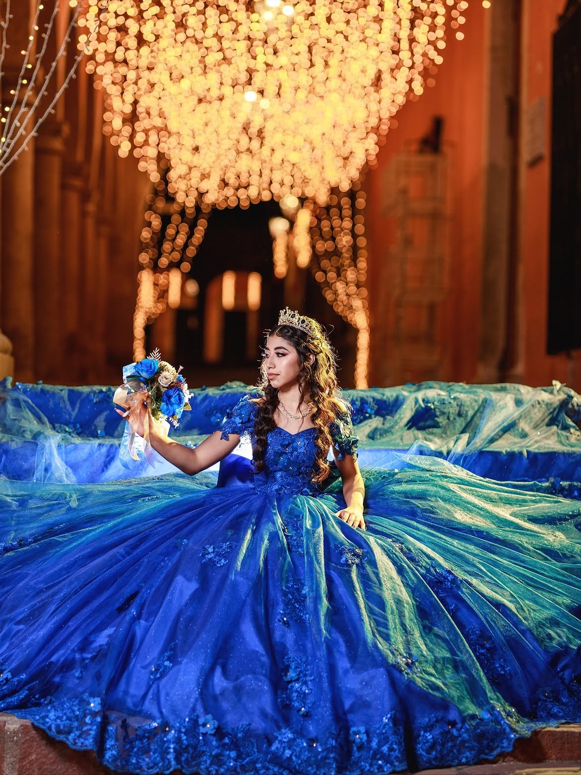 Sweet 16 in blue gown under a golden chandelier — Sweet Sixteen celebration in West Palm Beach