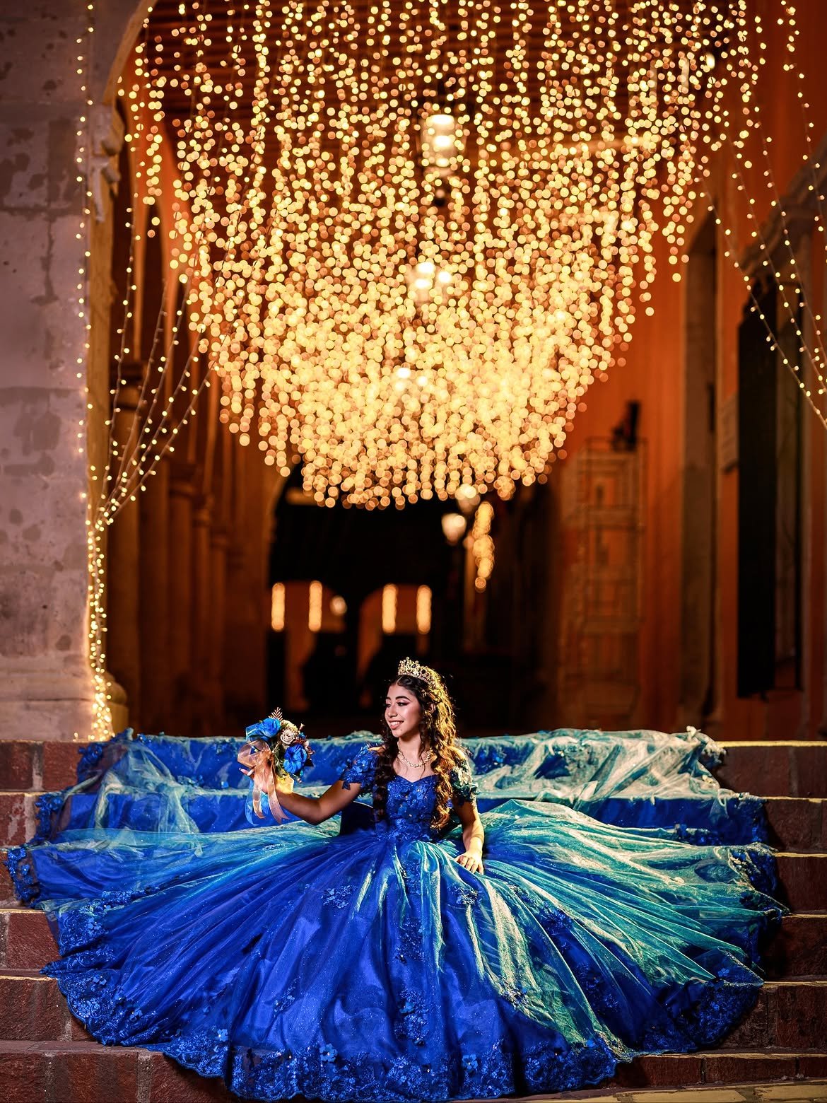 Sweet 16 in blue gown on illuminated staircase — Sweet Sixteen party in West Palm Beach