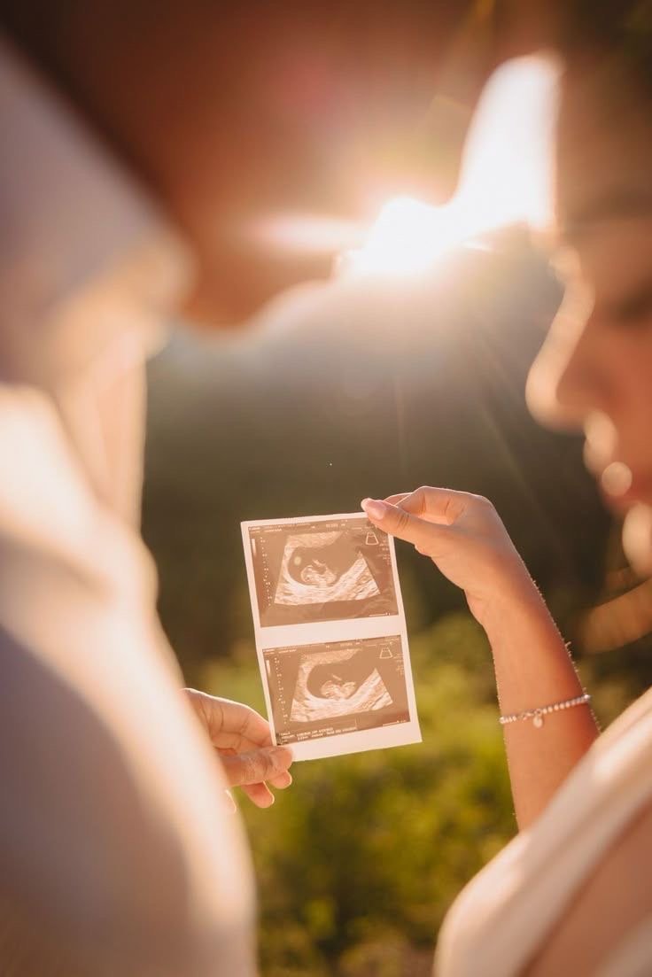 Couple announcing their pregnancy during a photo session