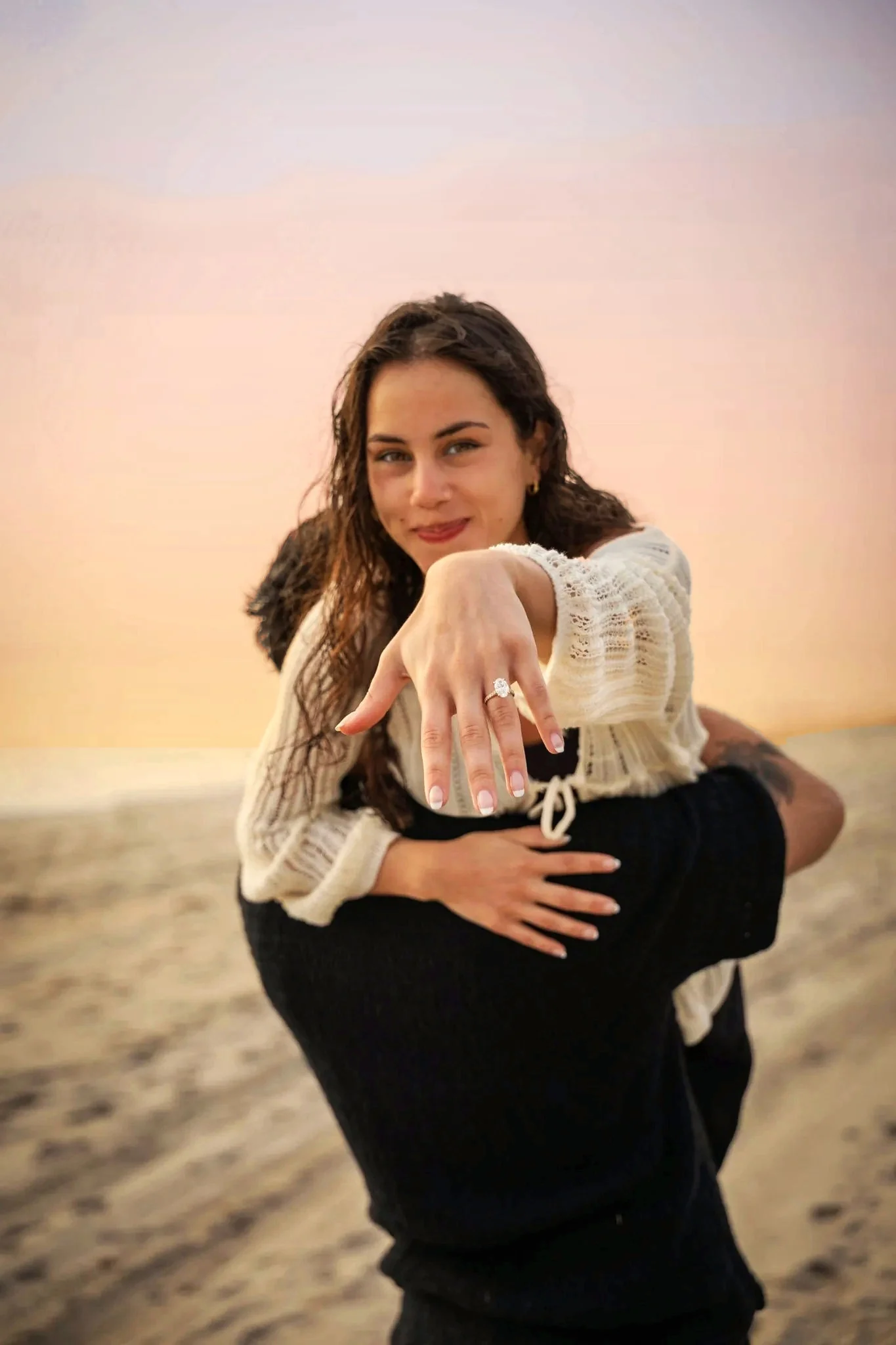 Woman showing engagement ring to camera West Palm Beach engagement photographer diamond ring reveal