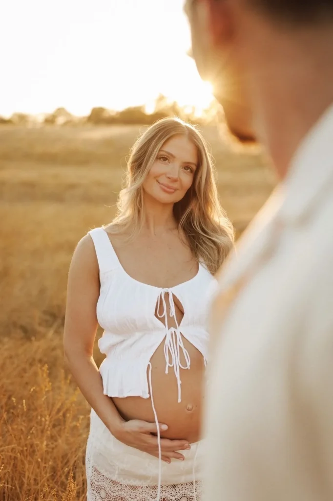 Expecting mother photographed at sunset during a maternity session in South Florida
