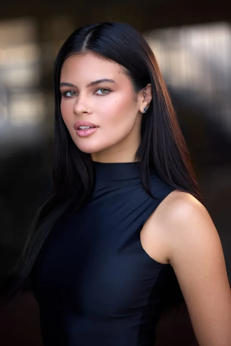 Professional headshot of a woman with long dark hair in a black top, West Palm Beach headshots