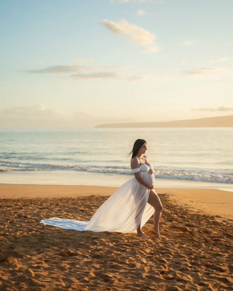 Mother-to-be walking along the shoreline during a maternity session